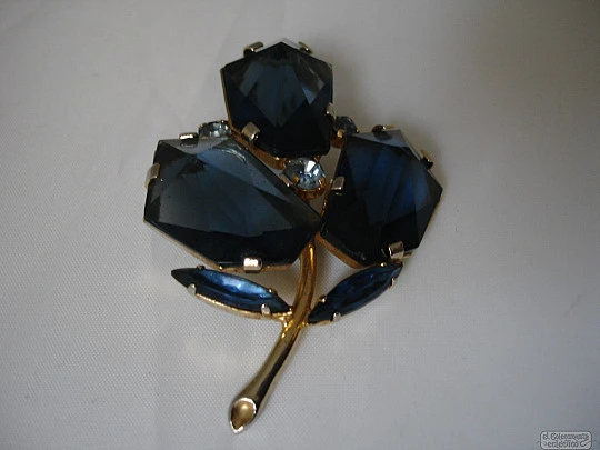 Brooch. Golden metal. Blue faceted stones. Flower. 1960's
