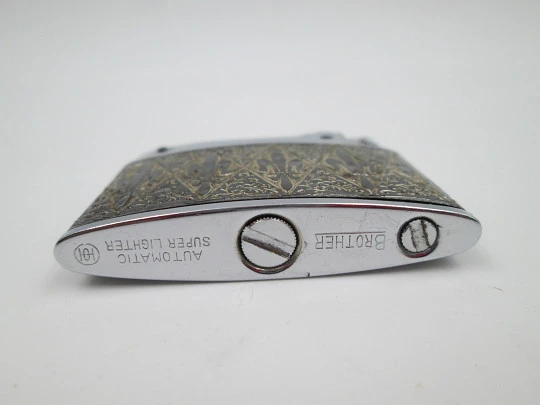 Brother-Lite pocket petrol lighter. Chromed plated. Fleurs-de-lis and vegetal motifs. 1950's