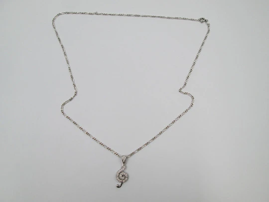 Cadena con colgante nota musical. Plata de ley 925 y gemas blancas. 1990