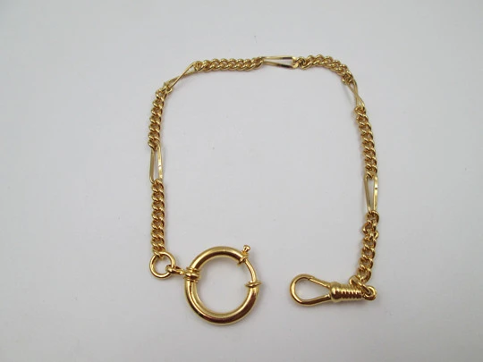 Cadena reloj de bolsillo. Metal chapado oro. Eslabones y ochos. Argolla y mosquetón. 1980
