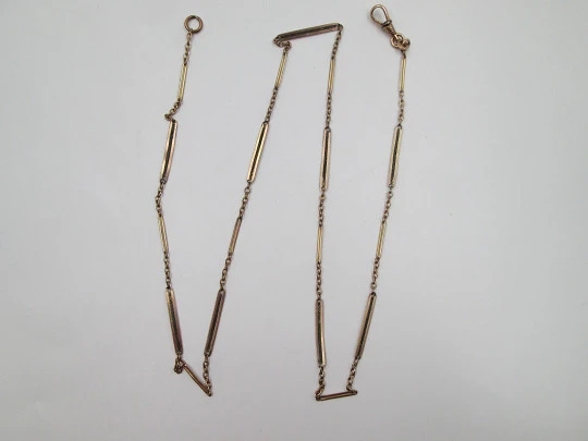 Cadena reloj de bolsillo. Metal chapado oro. Eslabones y rectángulos calados. Mosquetón