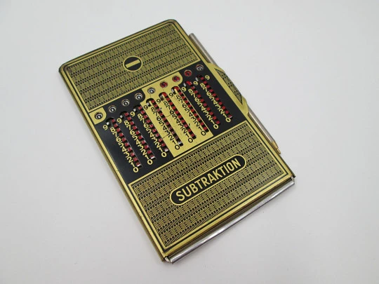 Calculadora mecánica de bolsillo Addiator Duplex. Aluminio chapado oro. Alemania. 1950