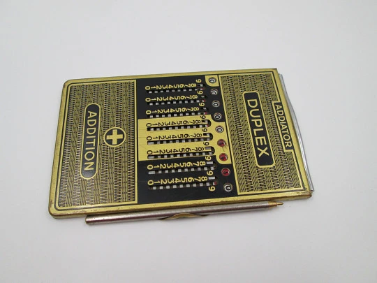 Calculadora mecánica de bolsillo Addiator Duplex. Aluminio chapado oro. Alemania. 1950
