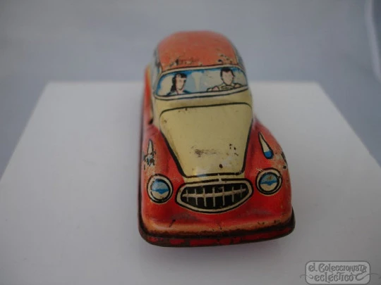 Car. Lithographed tinplate. Red / cream. Manual winding. Germany