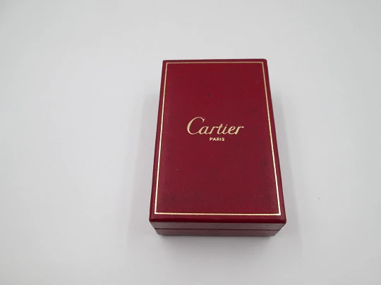 Cartier butane lighter. Yellow rolled gold. Waves pattern. Original box. France. 1990's