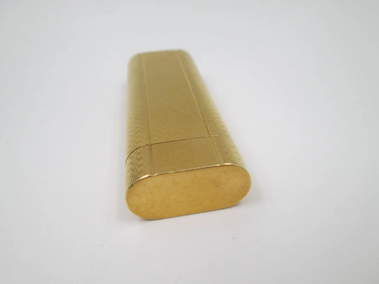 Cartier butane lighter. Yellow rolled gold. Waves pattern. Original box. France. 1990's