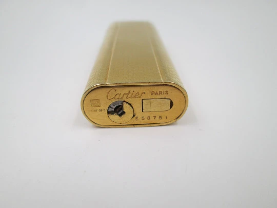 Cartier butane lighter. Yellow rolled gold. Waves pattern. Original box. France. 1990's