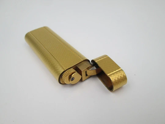 Cartier butane lighter. Yellow rolled gold. Waves pattern. Original box. France. 1990's