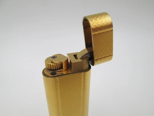 Cartier butane lighter. Yellow rolled gold. Waves pattern. Original box. France. 1990's