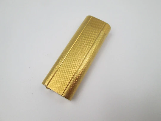 Cartier butane lighter. Yellow rolled gold. Waves pattern. Original box. France. 1990's