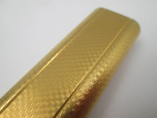 Cartier butane lighter. Yellow rolled gold. Waves pattern. Original box. France. 1990's