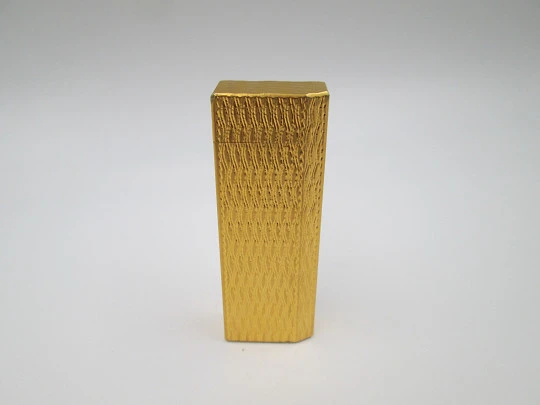 Cartier butane pocket lighter. Yellow rolled gold. Waves pattern. France. 1990's