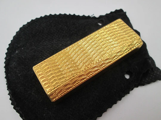 Cartier butane pocket lighter. Yellow rolled gold. Waves pattern. France. 1990's