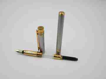 Cartier Le Must Santos fountain pen. Satin steel & gold plated details. 2000's. France