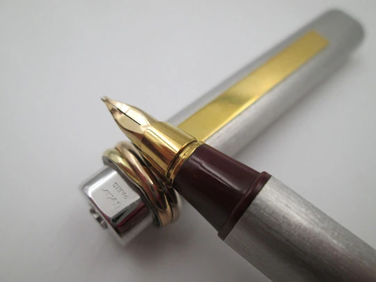 Cartier Le Must Vendome Trinity. Silver and gold plated. Burgundy resin section