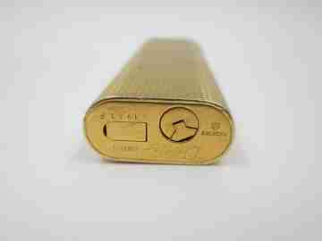 Cartier Paris butane lighter. Rhomboid decoration. Rolled gold. Swiss. 1990's