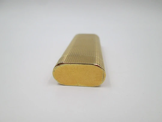 Cartier Paris butane lighter. Rhomboid decoration. Rolled gold. Swiss. 1990's