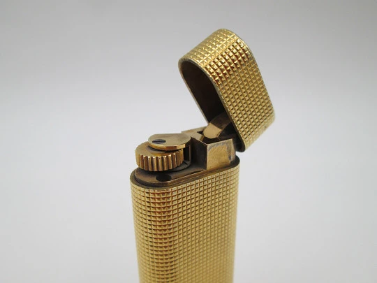 Cartier Paris butane lighter. Rhomboid decoration. Rolled gold. Swiss. 1990's