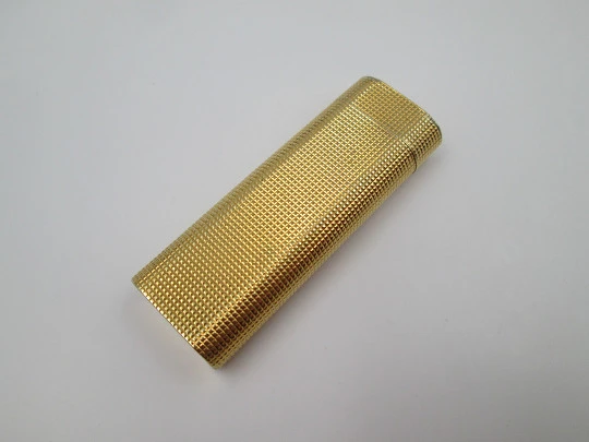 Cartier Paris butane lighter. Rhomboid decoration. Rolled gold. Swiss. 1990's