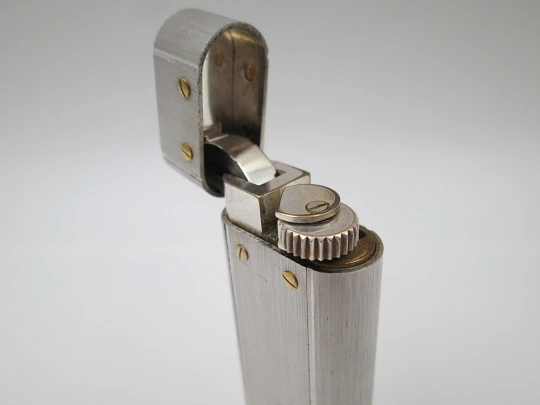 Cartier Paris Santos butane lighter. Silver plated and gold filled details. 1980's. Swiss
