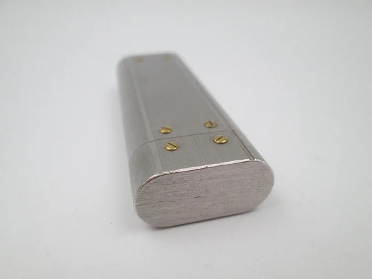 Cartier Paris Santos butane lighter. Silver plated and gold filled details. 1980's. Swiss