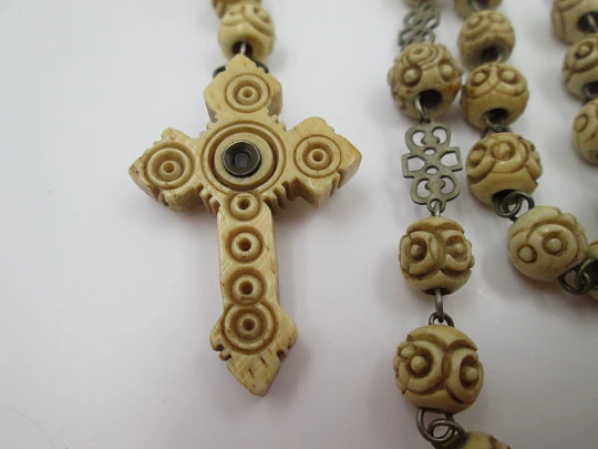 Carved bone rosary. Cross with viewer and Virgin of Montserrat medal. Silver plated. 1910's