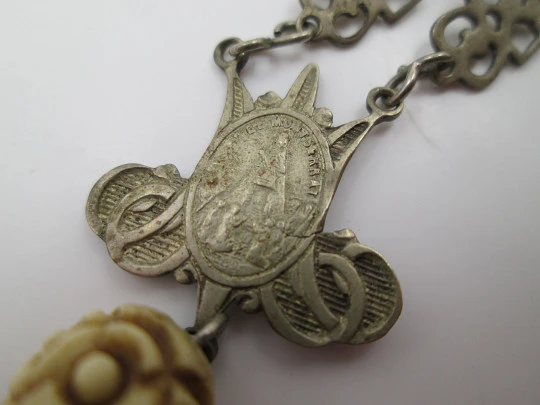 Carved bone rosary. Cross with viewer and Virgin of Montserrat medal. Silver plated. 1910's