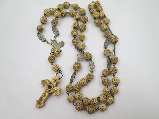 Carved bone rosary. Cross with viewer and Virgin of Montserrat medal. Silver plated. 1910's