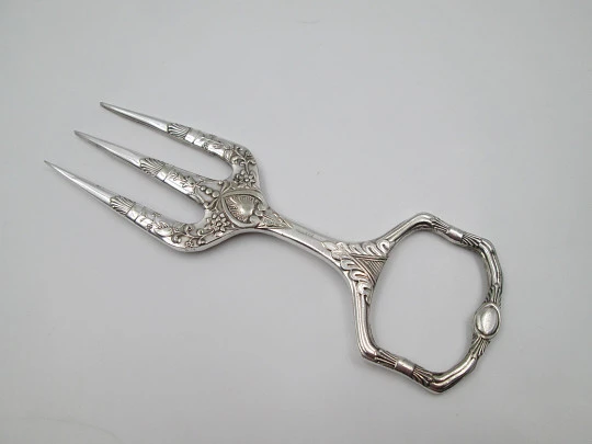 Carving fork. Electro plated nickel silver. Floral and vegetable motifs. 1940's. England