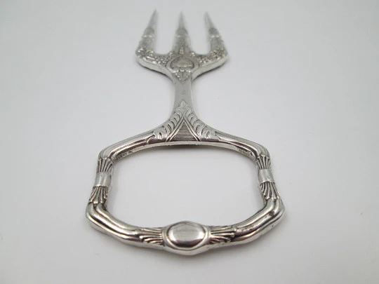 Carving fork. Electro plated nickel silver. Floral and vegetable motifs. 1940's. England