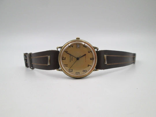 Cauny Darwil. Gold plated and steel. Manual wind. Calendar. Leather strap. 1970's. Swiss
