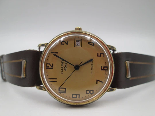 Cauny Darwil. Gold plated and steel. Manual wind. Calendar. Leather strap. 1970's. Swiss Cauny Darwil. Gold plated and steel. Manual wind. Calendar. Leather strap. 1970's. Swiss