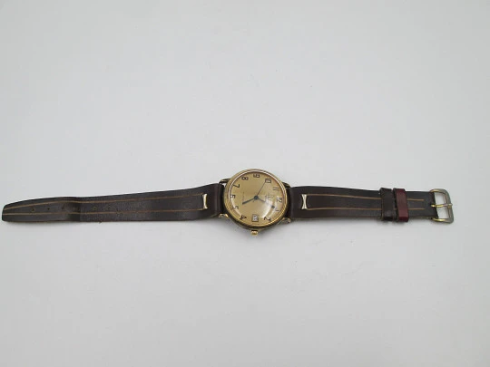 Cauny Darwil. Gold plated and steel. Manual wind. Calendar. Leather strap. 1970's. Swiss Cauny Darwil. Gold plated and steel. Manual wind. Calendar. Leather strap. 1970's. Swiss