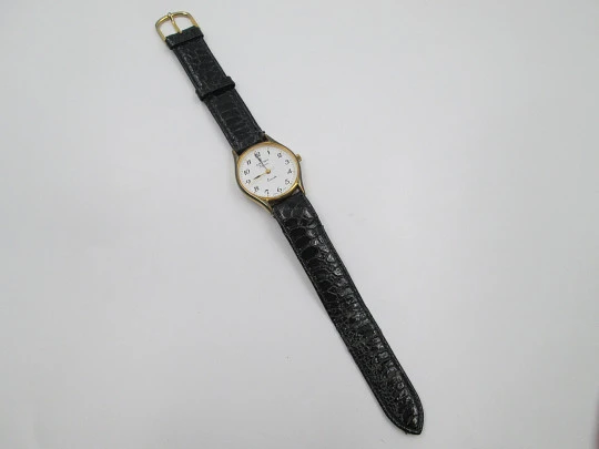 Cauny Elegance ladie's wristwatch. Quartz. Gold plated & steel. Strap. 1980's