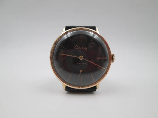 Cauny Prima De Luxe. 10 microns gold plated & steel. Manual wind. Black dial. 1970's. Swiss