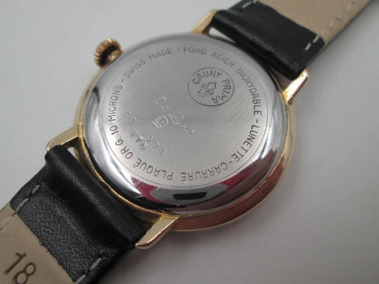 Cauny Prima De Luxe. 10 microns gold plated & steel. Manual wind. Black dial. 1970's. Swiss