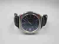 Certina alarm wristwatch. Steel. Automatic. 1970's. Date. Square case