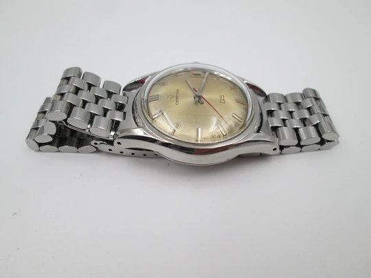 Certina DS Turtle. Stainless steel. Manual wind. Calendar. Bracelet. Golden dial. 1960's