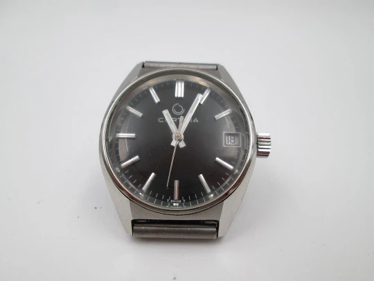 Certina. Acero inoxidable. Esfera negra. Cuerda manual. Calendario. Brazalete. 1970
