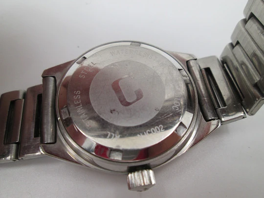 Certina. Acero inoxidable. Esfera negra. Cuerda manual. Calendario. Brazalete. 1970
