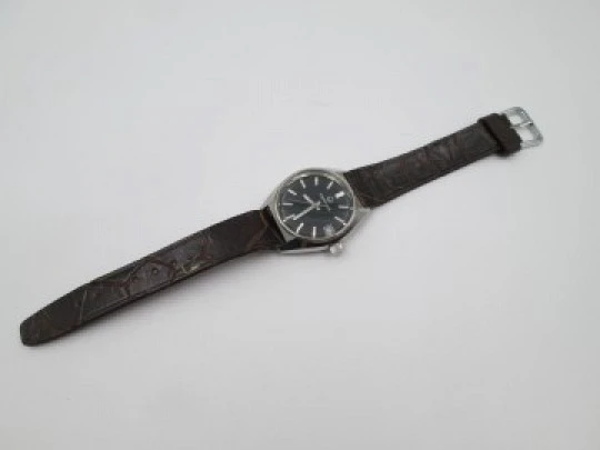 Certina. Stainless steel. Automatic. Calendar. Black dial. Strap. Swiss. 1970's