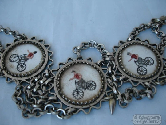 Chatelaine pocket watch. Nickel plated metal. Enamels. Cyclists