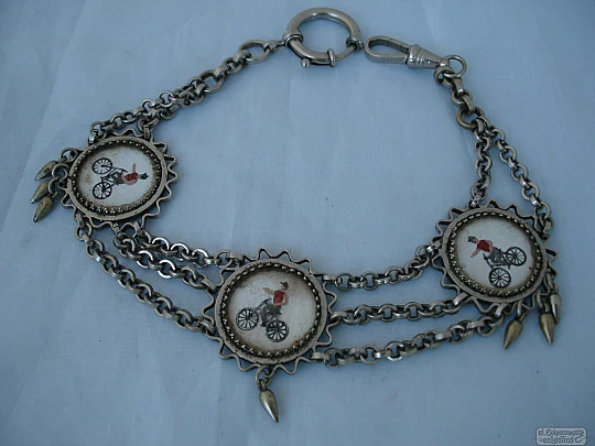 Chatelaine pocket watch. Nickel plated metal. Enamels. Cyclists