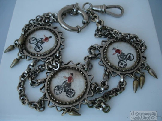 Chatelaine pocket watch. Nickel plated metal. Enamels. Cyclists