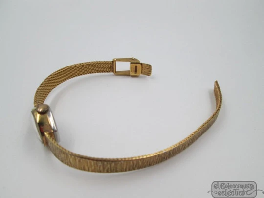 Chilex. Acero / metal dorado. Cuerda manual. Suiza. Brazalete. Mujer