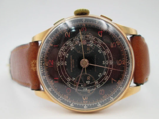 Chronographe Suisse. 18 karat yellow gold. Manual winding. Black dial. 1960's. Swiss