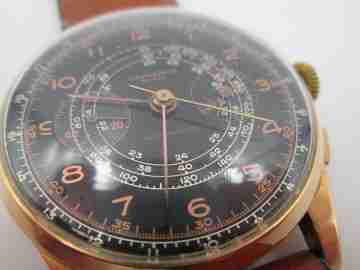 Chronographe Suisse. Black dial. 18 karat gold. Manual winding