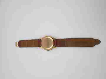Chronographe Suisse. Esfera negra. Oro 18K. Cuerda. Años 60
