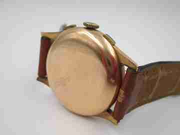 Chronographe Suisse. Esfera negra. Oro 18K. Cuerda. Años 60