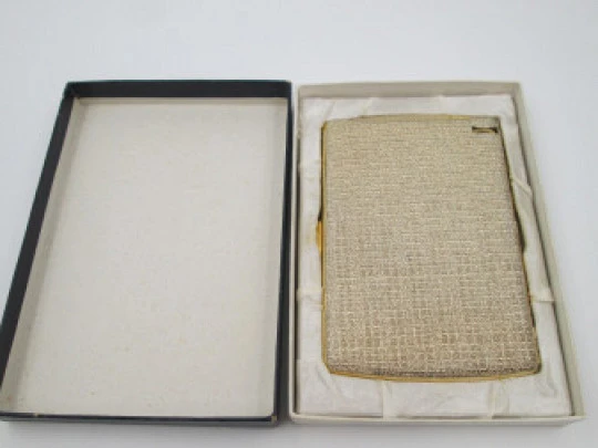 Cigarette case with petrol lighter. Gold plated metal. Grainy texture front. Box. 1960's